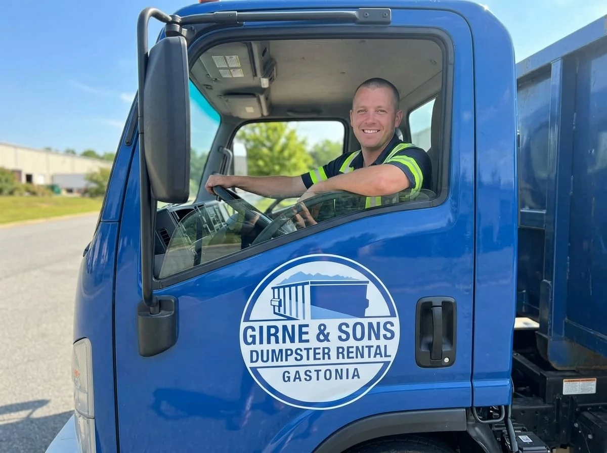 A Girne & Sons Dumpster Rental Gastonia driver ready for delivery in Gastonia, NC