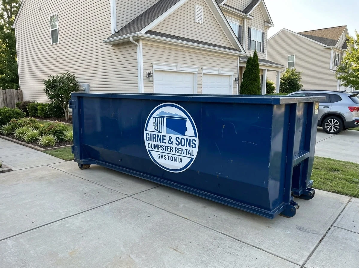 Girne & Sons Dumpster Rental Gastonia roll-off dumpster delivered to a residential driveway in Gastonia, NC